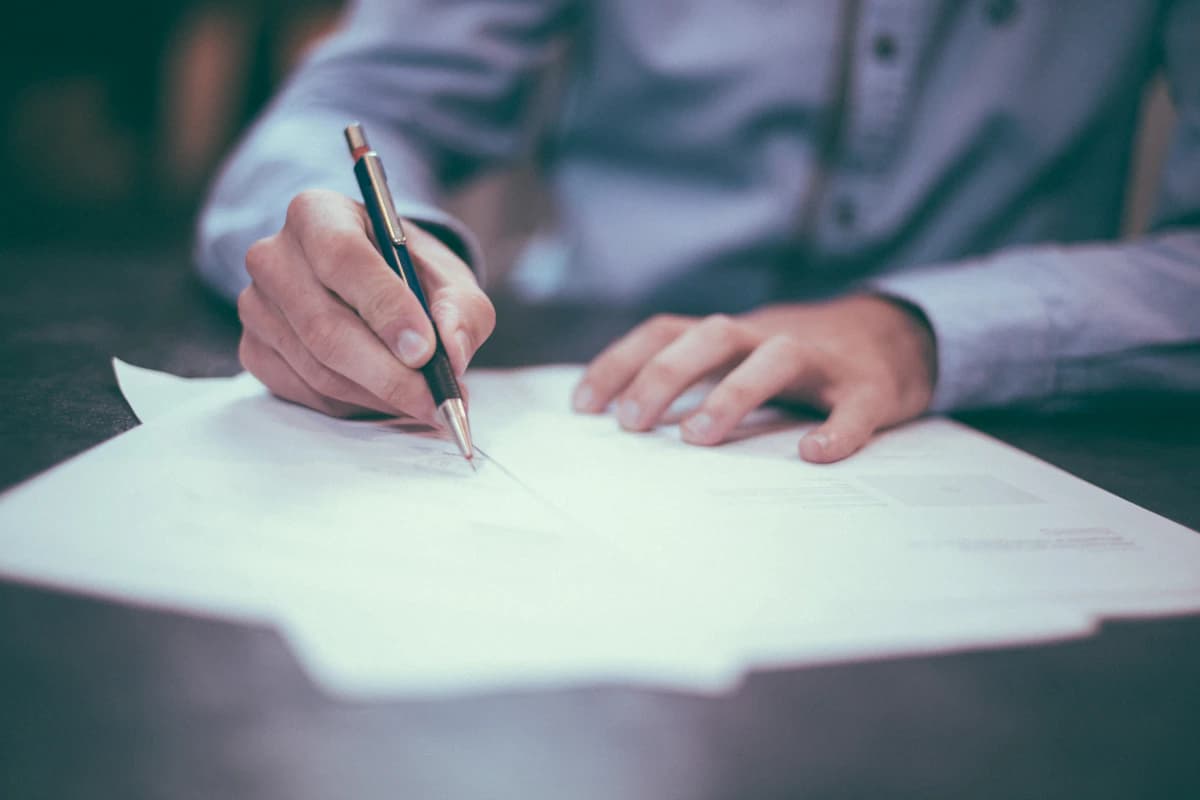 Professional completing digital forms and paperwork
